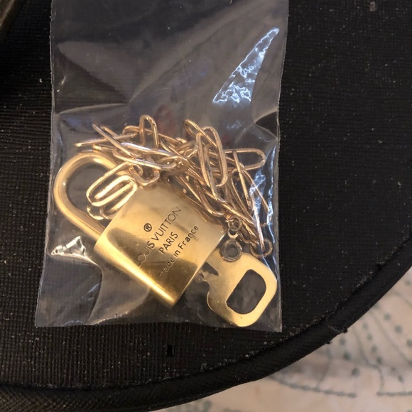Louis Vuitton Lock & key # 310. Comes on 16” necklace. Looks NEW! - Picture 4 of 5